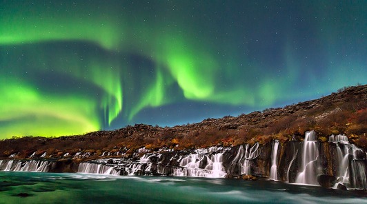 aurora borealis over hraunfossar iceland